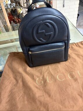 Gucci Black Pebbled Leather Mini Backpack with Embossed Logo